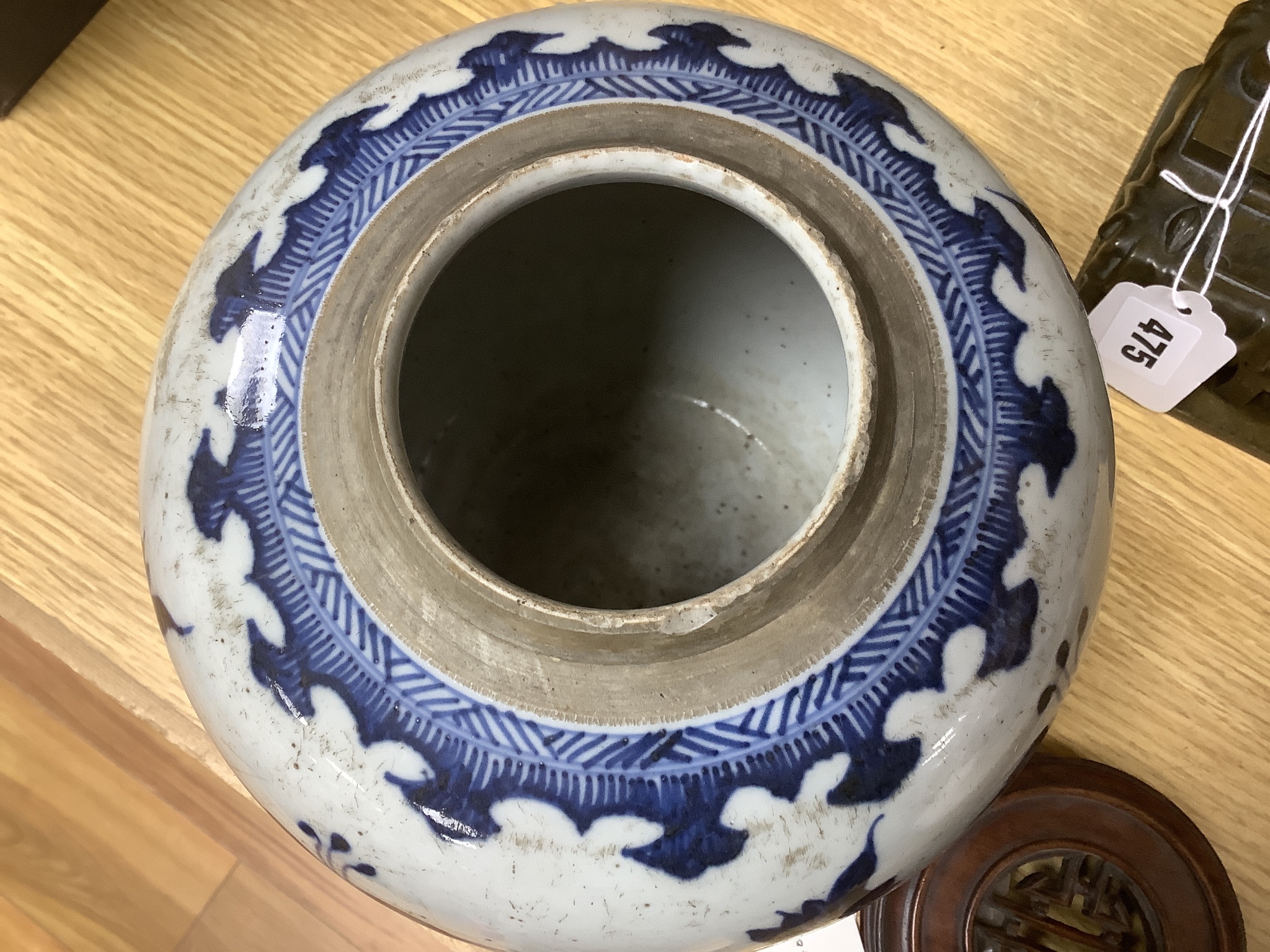 A 18th/19th century Chinese blue and white jar and wood cover - 22cm high